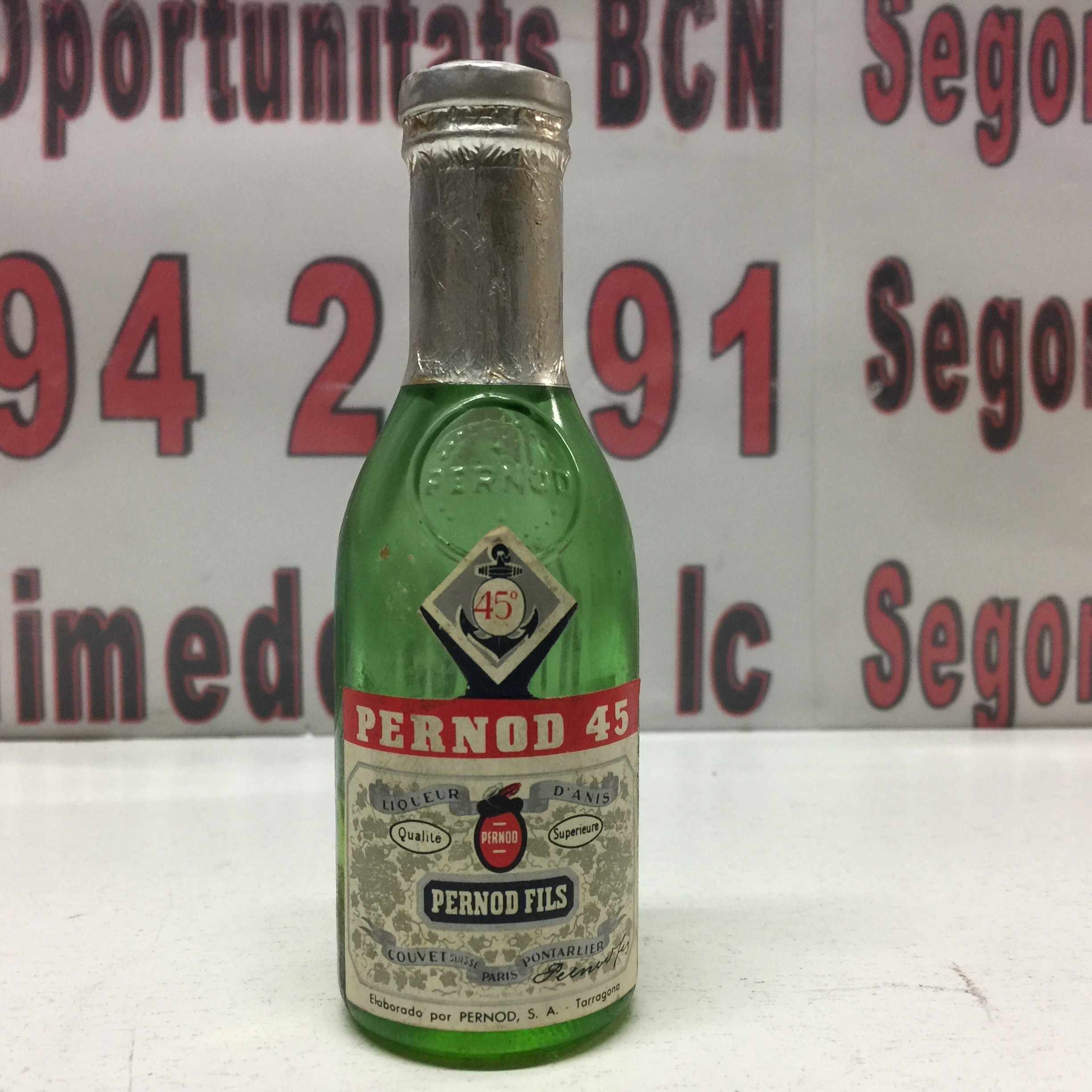 1 Botella Pernod 45 , con sello de 50 céntimos